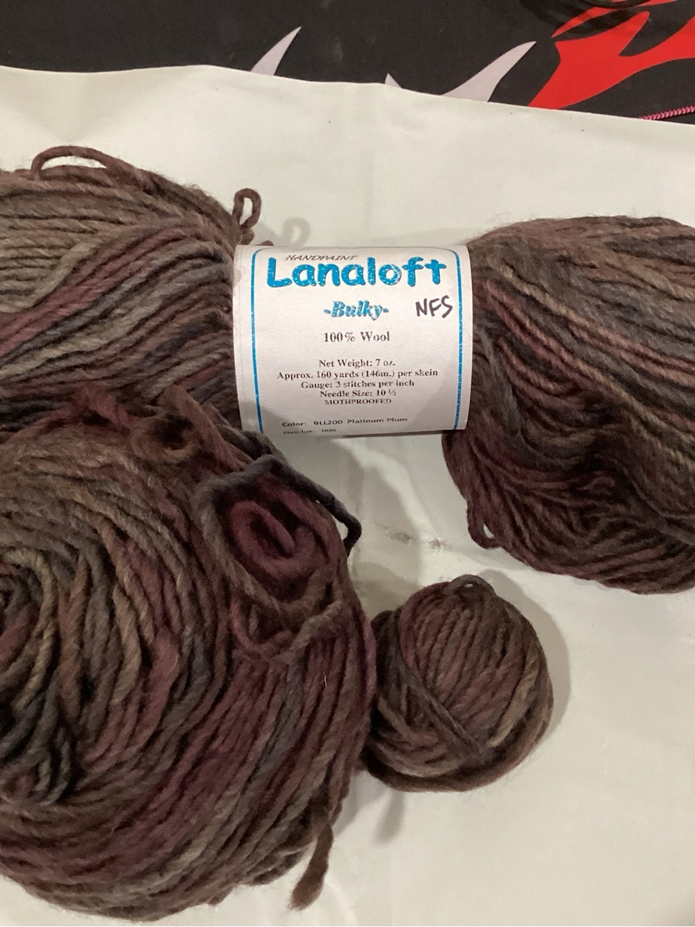 2 hanks + partial brown sheep co Lanaloft yarn in platinum plum colorway